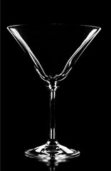 Martini glass silhouette on black background