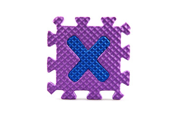 Alphabet puzzle pieces on white background