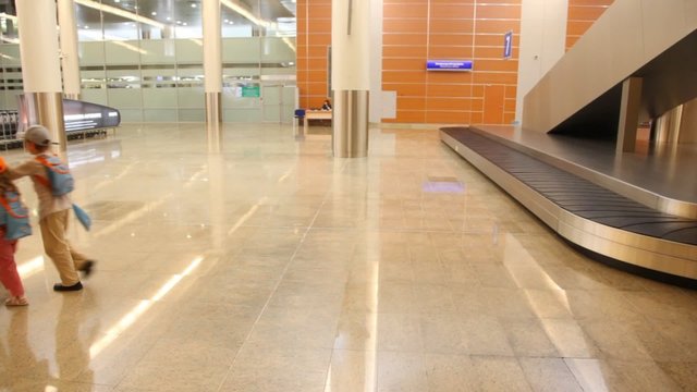 children walking with luggage trolley