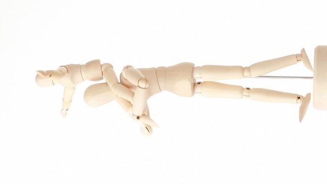 wooden figures of child sitting on neck of his parent