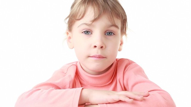 little girl looks at camera initially sadness, then happy