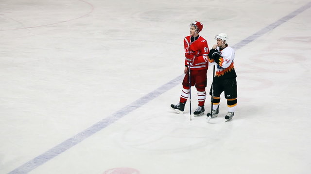Friendly hockey players from two teams on junior hockey match
