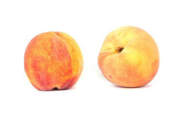 Two peaches isolated on white background.