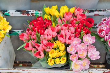 Bouquet of Flowers Tulips in a Old Metal Flourist Display