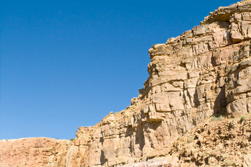 Fototapeta na wymiar Crumbling Sandstone Cliff Side Near Abiquiu, New Mexico, USA