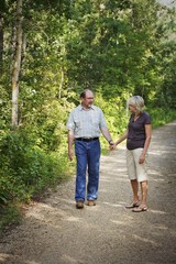 Fototapeta na wymiar Husband And Wife On Walking Trail