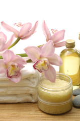 Fototapeta na wymiar spa concept with orchid and Bottle of massaging oil,