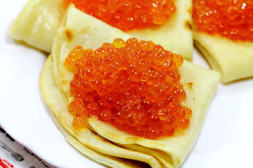 Tasty pancakes with soft caviar on the plate