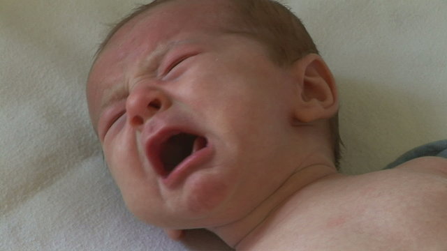 Newborn baby unhappy and crying
