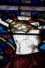Detail of stained glass religious window in church