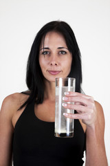 Woman drinking an effervescent tablet