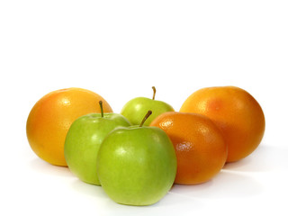 Grapefruit and green apples isolated on a white background
