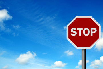 Photo realistic 'stop' sign against a bright blue sky