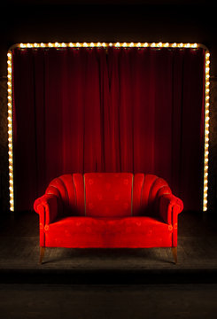 red sofa on the stage