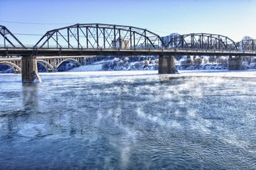Obraz premium Bridge over the Icy River
