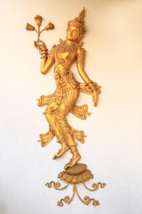 Decorative dance on temple wall.