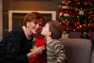 Little boy getting surprise at christmas