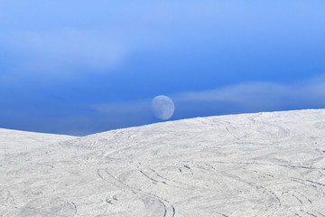 Piste with daylight moon