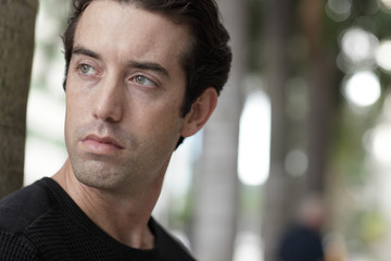 Handsome man looking over his shoulder