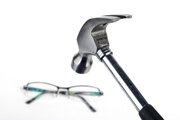 Eyeglass and hammer