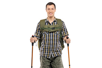 Man in sportswear with backpack and hiking poles