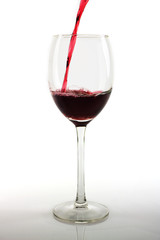 Pouring red wine into a glass