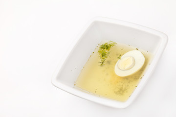 Chicken broth with dill and egg