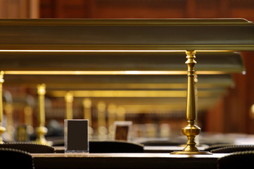 Antique study lamps on tables in a  library