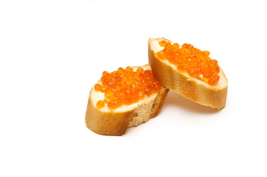 red caviar with bread and butter on white background