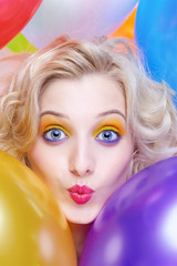 blonde girl with balloons