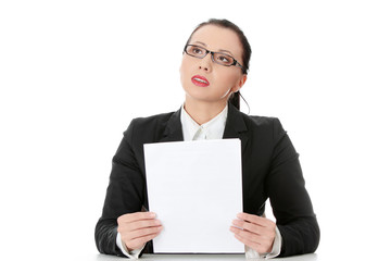 Young businesswoman behind the desk