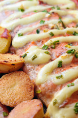 Fried fish with onion closeup