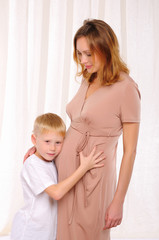 little boy and his pregnant mother