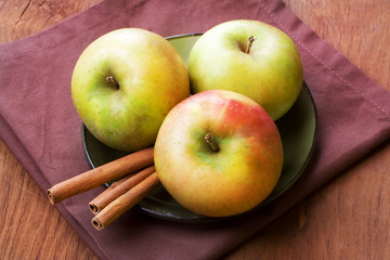 Apples with cinnamon, still life.