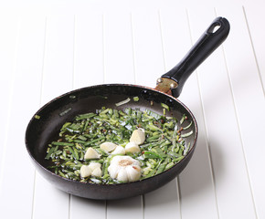 Stir frying spring onion and garlic