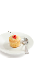 Vanilla muffin with a cherry marascino