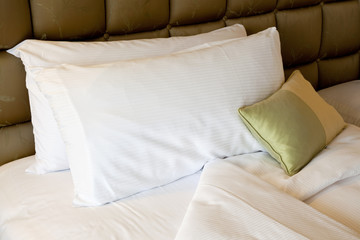 Comfortable bed with pillows and quilt cover