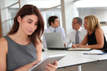 Executive woman working on electronic tab