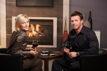 Young businesspeople drinking wine