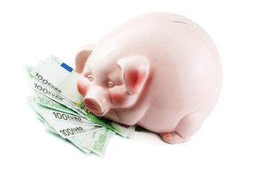 happy piggybank on heap of euros