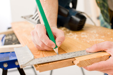 Fototapeta na wymiar Home improvement - handyman prepare wooden floor