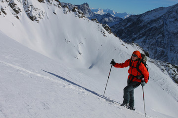 Young woman doing ski touring. Outdoor winter activity