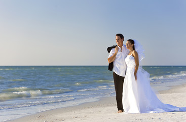 Fototapeta na wymiar Bride & Groom Married Couple at Beach Wedding