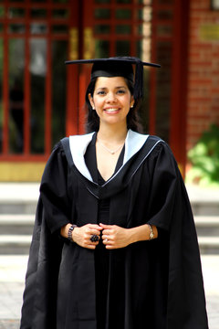 A portrait of a young girl in a graduation gown.