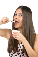Beautiful asian girl eat yogurt with a spoon. Healthy eating