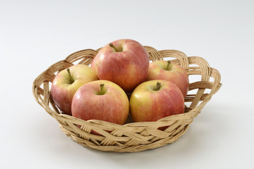 Red apples in a basket.