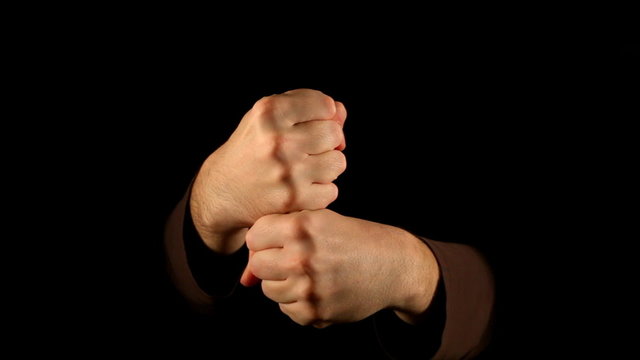 Strangulation gesture on black background