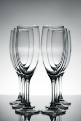Empty champagne glasses on gray background