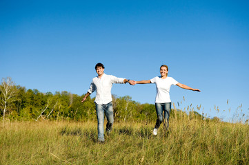 Fototapeta na wymiar young couple running