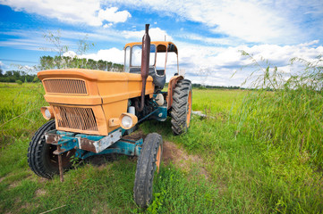 Old yellow farm tractor
